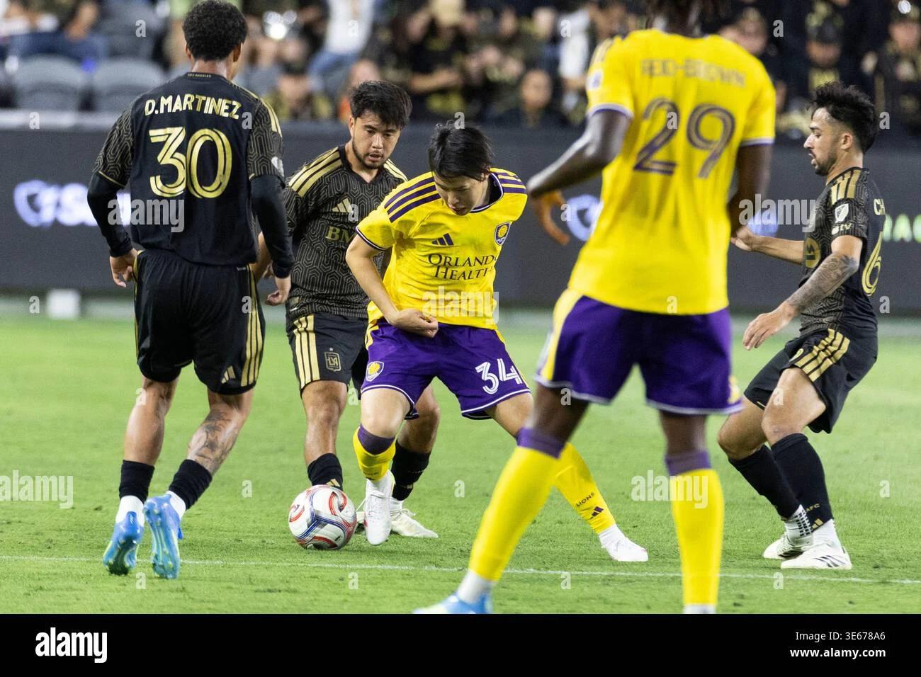 Orlando City s Yutaro Tsukada 34 and Los Angeles FC s Ryan Raposo 21 Orlando City s Yutaro Tsukada 34 and Los Angeles FC s Ryan Raposo 21